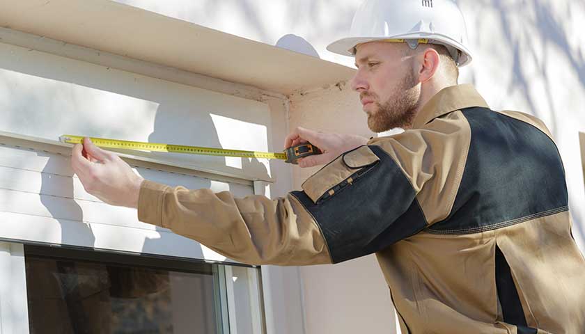 Measuring wooden window outside