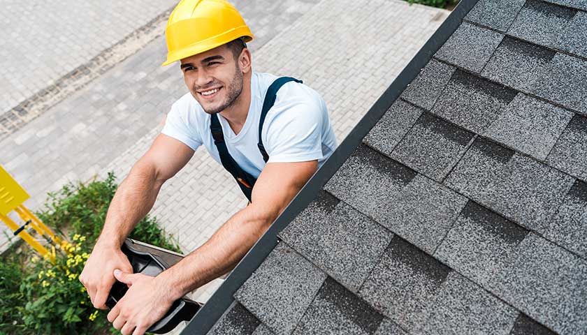Overhead view of happy man in yellow helmet